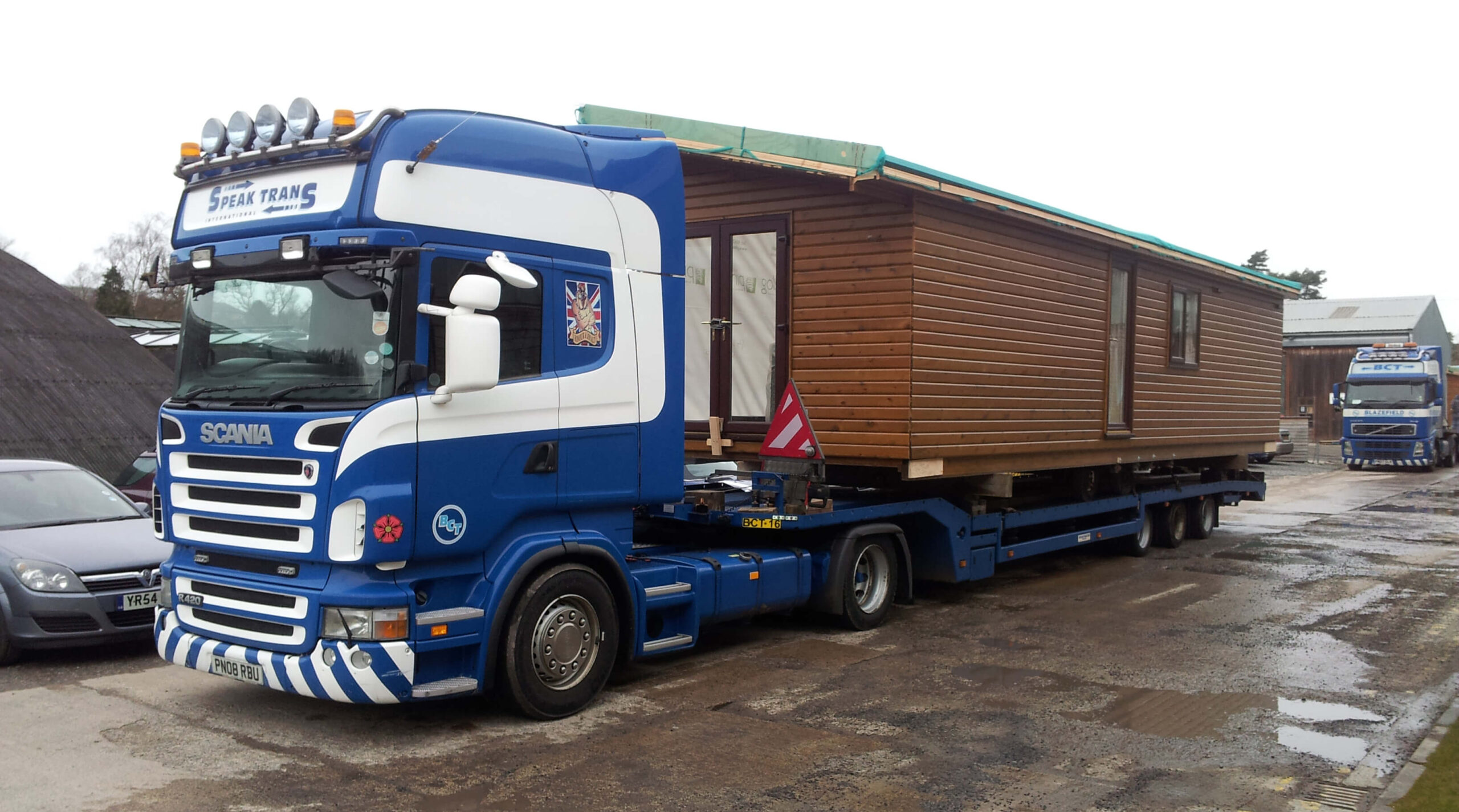 Pinelog lodge on a transportation lorry ready for delivery