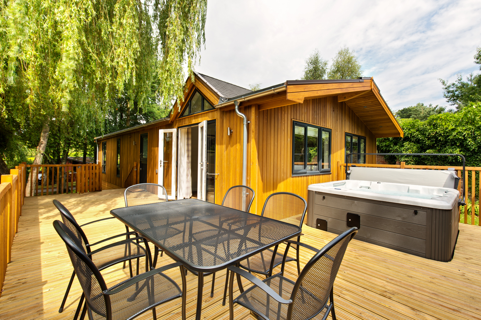 Sandybrook Luxury Lodges Holiday Park—beautiful example of lodge and decking outside